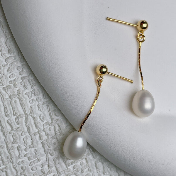 Élégantes boucles d'oreilles en perles