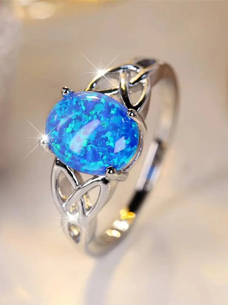 Bague vintage en argent et opale bleue